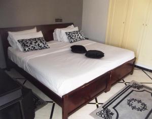 Postel nebo postele na pokoji v ubytování Hotel Al Kabir