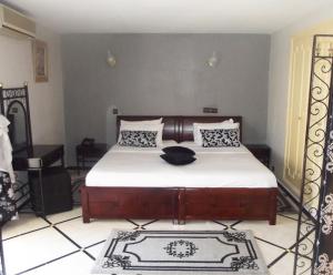 Postel nebo postele na pokoji v ubytování Hotel Al Kabir