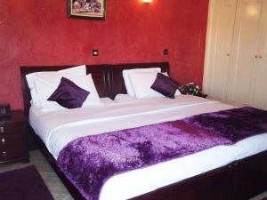 Postel nebo postele na pokoji v ubytování Hotel Al Kabir