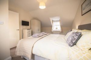 Postel nebo postele na pokoji v ubytování Middle Row Cottage