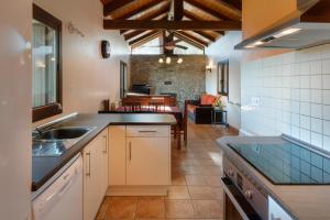 a kitchen with a sink and a counter top at O Zierzo in Jaca