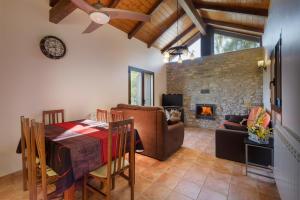 a dining room with a table and a fireplace at O Zierzo in Jaca