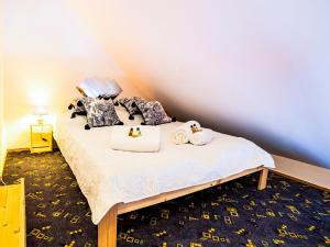 Posteľ alebo postele v izbe v ubytovaní Apartamenty Niebo
