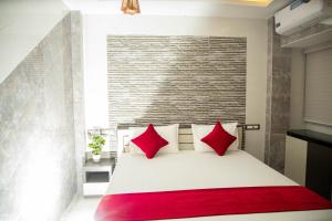Postel nebo postele na pokoji v ubytování Hotel Ganesh Palace