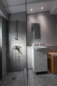 a bathroom with a shower and a sink at Athenian Port Luxury Apartment 2/Piraeus Riviera in Piraeus