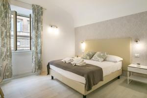 Posteľ alebo postele v izbe v ubytovaní White Candia Guesthouse