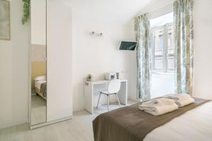 Posteľ alebo postele v izbe v ubytovaní White Candia Guesthouse
