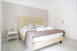 Posteľ alebo postele v izbe v ubytovaní White Candia Guesthouse
