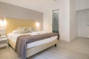 Posteľ alebo postele v izbe v ubytovaní White Candia Guesthouse