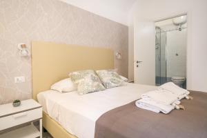 Posteľ alebo postele v izbe v ubytovaní White Candia Guesthouse