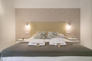 Posteľ alebo postele v izbe v ubytovaní White Candia Guesthouse