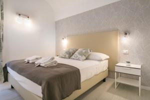 Posteľ alebo postele v izbe v ubytovaní White Candia Guesthouse