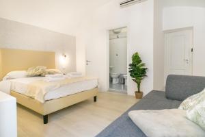 Posteľ alebo postele v izbe v ubytovaní White Candia Guesthouse