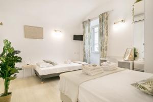 Posteľ alebo postele v izbe v ubytovaní White Candia Guesthouse