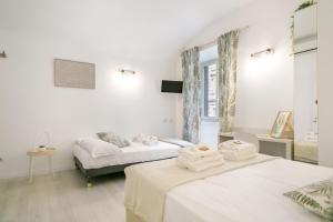 Posteľ alebo postele v izbe v ubytovaní White Candia Guesthouse