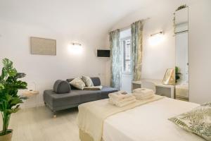 Posteľ alebo postele v izbe v ubytovaní White Candia Guesthouse