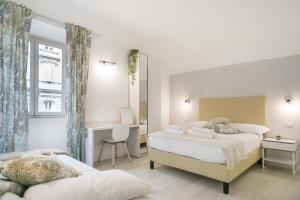 Posteľ alebo postele v izbe v ubytovaní White Candia Guesthouse