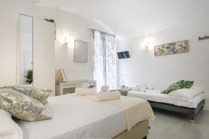 Posteľ alebo postele v izbe v ubytovaní White Candia Guesthouse