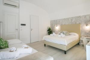Posteľ alebo postele v izbe v ubytovaní White Candia Guesthouse