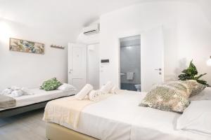 Posteľ alebo postele v izbe v ubytovaní White Candia Guesthouse