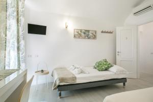 Posteľ alebo postele v izbe v ubytovaní White Candia Guesthouse