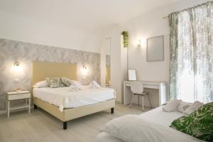 Posteľ alebo postele v izbe v ubytovaní White Candia Guesthouse