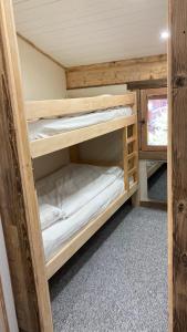 a couple of bunk beds in a tiny house at Studio Mezzanine Megeve centre in Megève