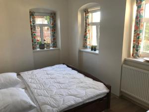 Postel nebo postele na pokoji v ubytování Apartmán DUO Plešivec