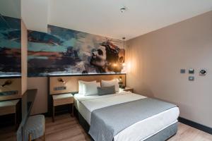 Ένα ή περισσότερα κρεβάτια σε δωμάτιο στο Ni Hotel Lara