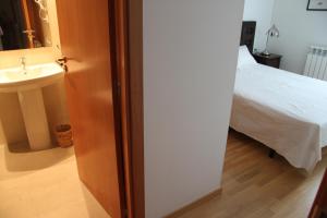 Posteľ alebo postele v izbe v ubytovaní Apartaments Centre Figueres