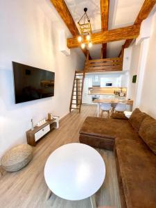 a living room with a couch and a table at Angel Apartment Černý důl in Černý Dŭl