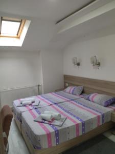 Postelja oz. postelje v sobi nastanitve Atina Lux Hostel
