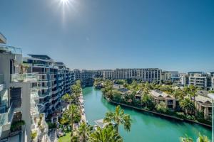 arial view of a river with palm trees and buildings at Juliette B 606 in Cape Town