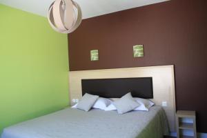 Ένα ή περισσότερα κρεβάτια σε δωμάτιο στο La Bonne Etape