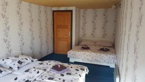 Postel nebo postele na pokoji v ubytování Chalupa V kopci