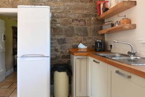 Η κουζίνα ή μικρή κουζίνα στο Mayfield Cottage +36 φωτογραφίες