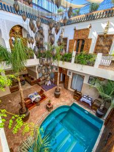 an overhead view of a house with a swimming pool at Riad Anya & SPA in Marrakech