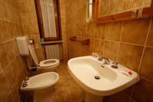 Koupelna v ubytování Hotel Col Serena