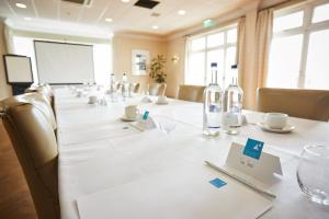 a conference room with a long table with bottles of wine at Trearddur Bay Hotel in Trearddur