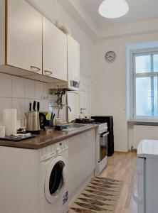 a kitchen with a washer and dryer in it at CENTER ! 2 stops from the City Center! in Vienna