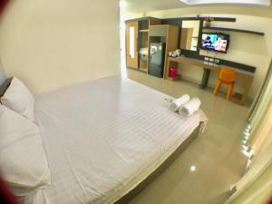 Postel nebo postele na pokoji v ubytování AP Grand Residence