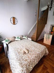 a bedroom with a bed with a hat on it at Charming Portuguese style apartment, for rent "Vida à Portuguesa", "Fruta or Polvo" Alojamento Local in Portimão