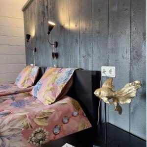Postel nebo postele na pokoji v ubytování B&B in de Dorpsstraat