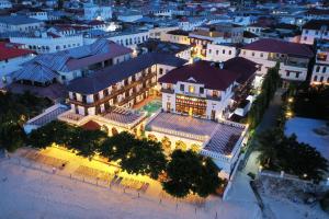 an aerial view of a building at night at Tembo House Hotel in Zanzibar City