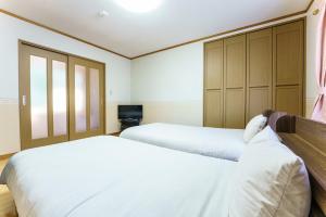 A bed or beds in a room at Bunzaemon