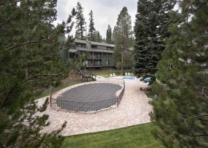 a view of a house with a large patio at St Anton Courtyard View Ski-In and Out 1 Bedroom Condo in Mammoth Lakes