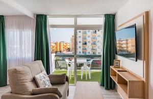 TV a/nebo společenská místnost v ubytování Roca Verde - Playa del Inglés