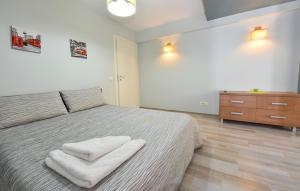 Postel nebo postele na pokoji v ubytování Royal Accommodation