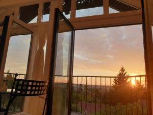 The sunrise or sunset as seen from a panziókat or nearby