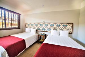 Postel nebo postele na pokoji v ubytování Hotel Caribe Merida Yucatan